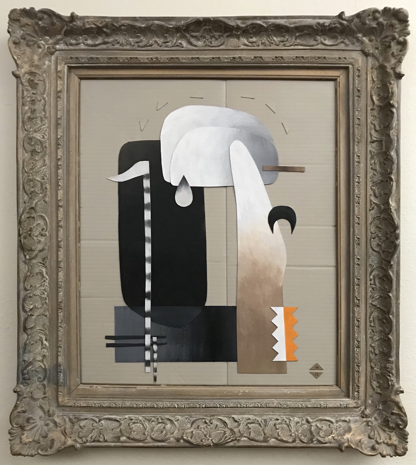 Abstract artwork with geometric shapes and muted colors in an ornate frame.
